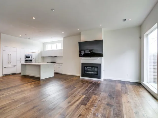a view of kitchen with microwave and window