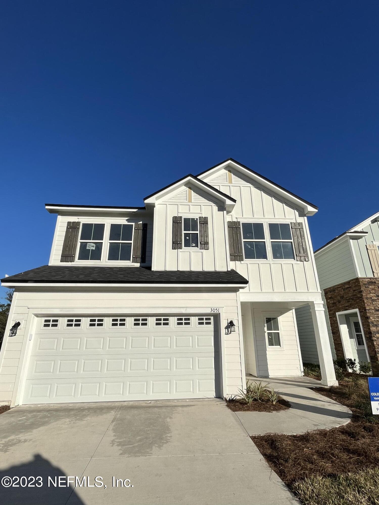 3051 Orange Picker Road Jacksonville, FL 32223 - Photo 5 of 7 a front view of a house with a balcony