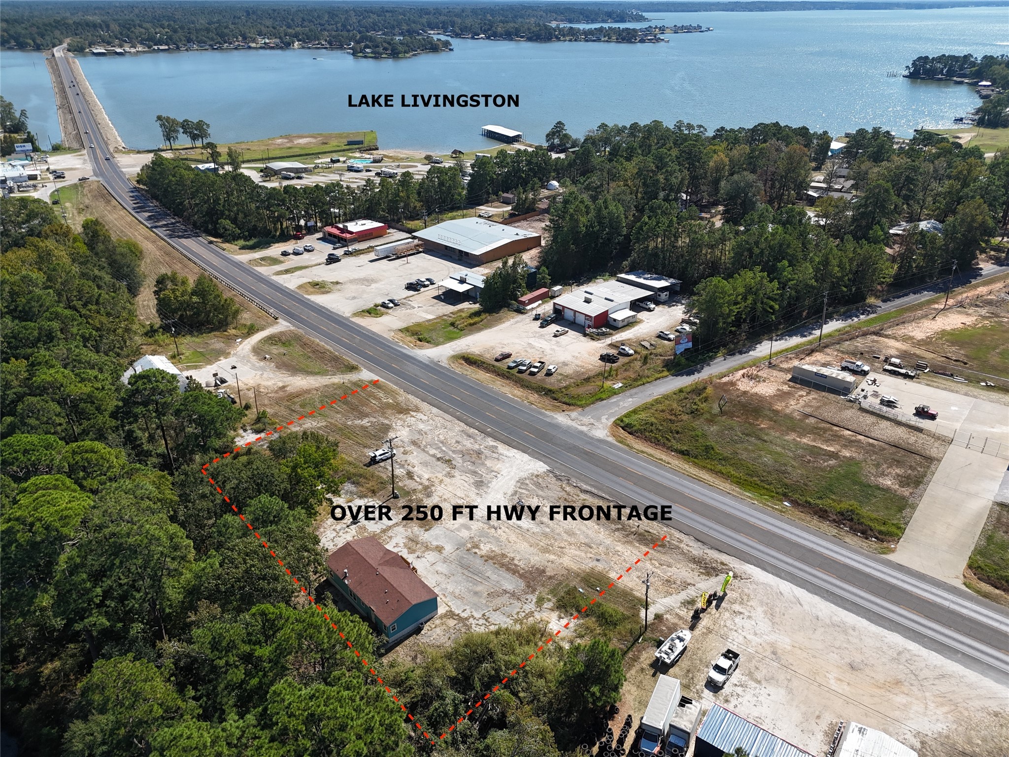 13402 U.S. Highway 190 Onalaska, TX 77360 - Photo 1 of 16 a view of a back yard of a house