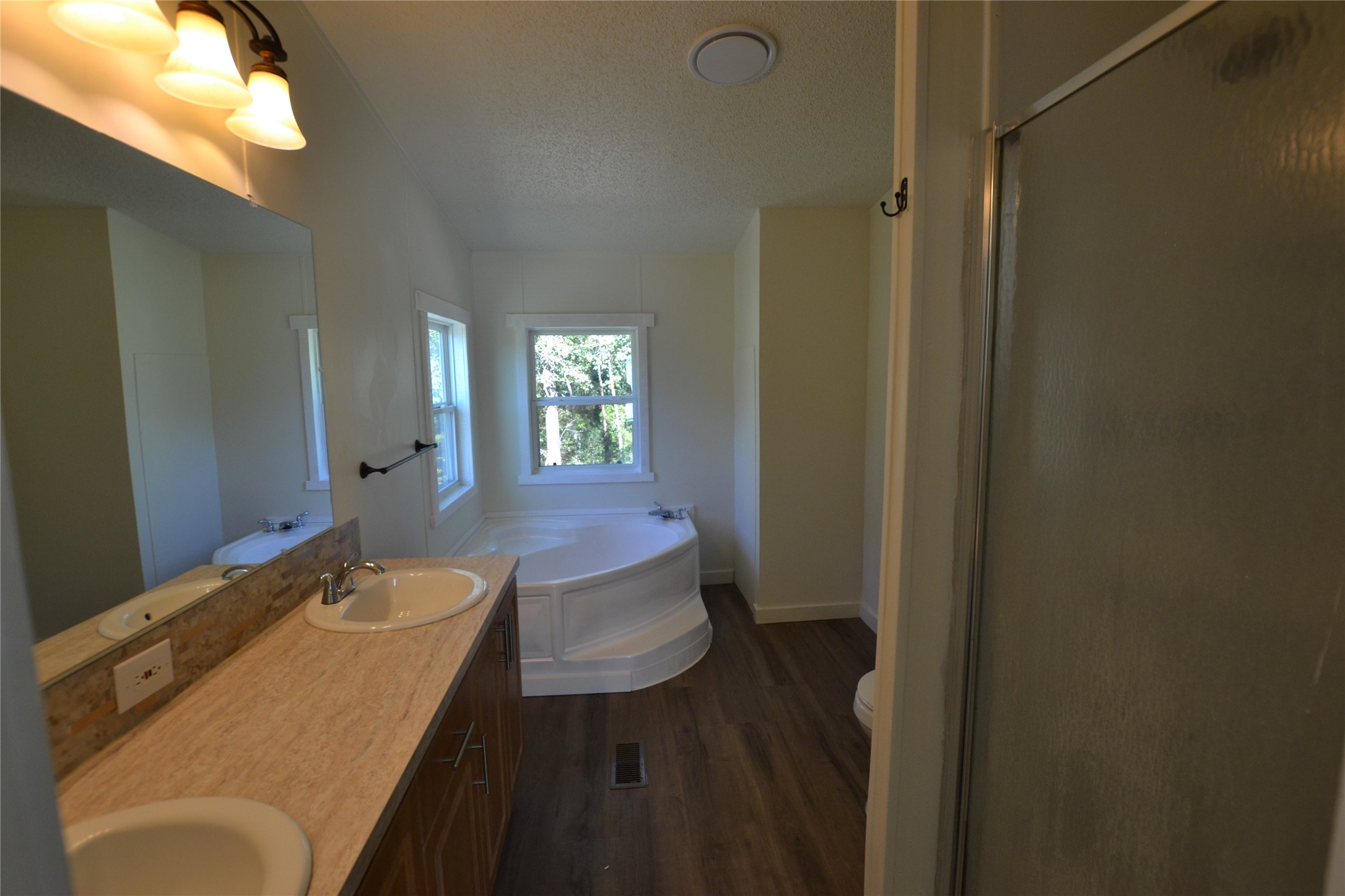 13402 U.S. Highway 190 Onalaska, TX 77360 - Photo 12 of 16 a bathroom with a sink and mirror
