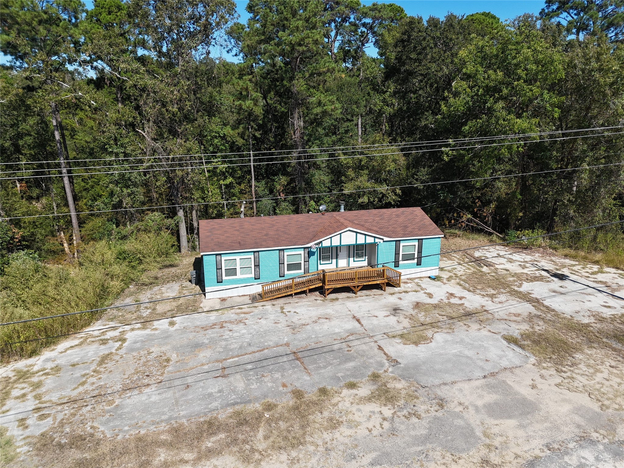 13402 U.S. Highway 190 Onalaska, TX 77360 - Photo 2 of 16 a view of a house with a yard
