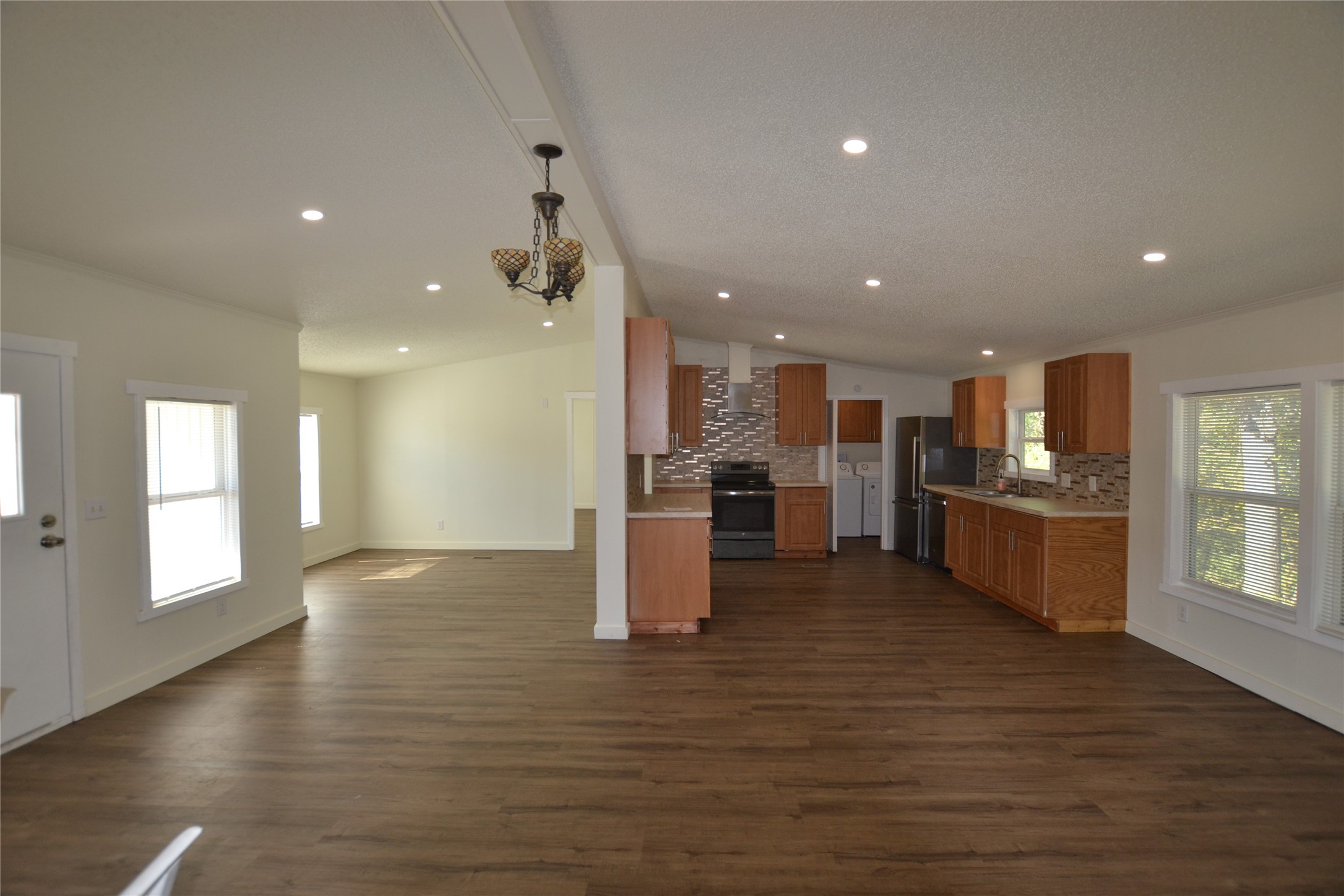 13402 U.S. Highway 190 Onalaska, TX 77360 - Photo 7 of 16 a view of kitchen with kitchen island wooden floor center island and stainless steel appliances
