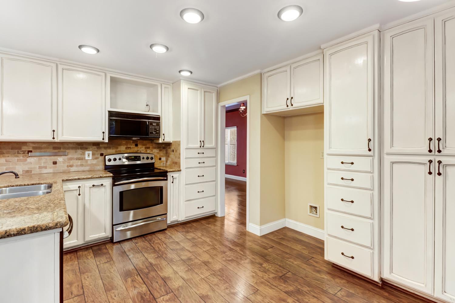 4683 Abrijo Road Cameron Park, CA 95682 - Photo 11 of 53 a kitchen with stainless steel appliances a refrigerator stove and sink