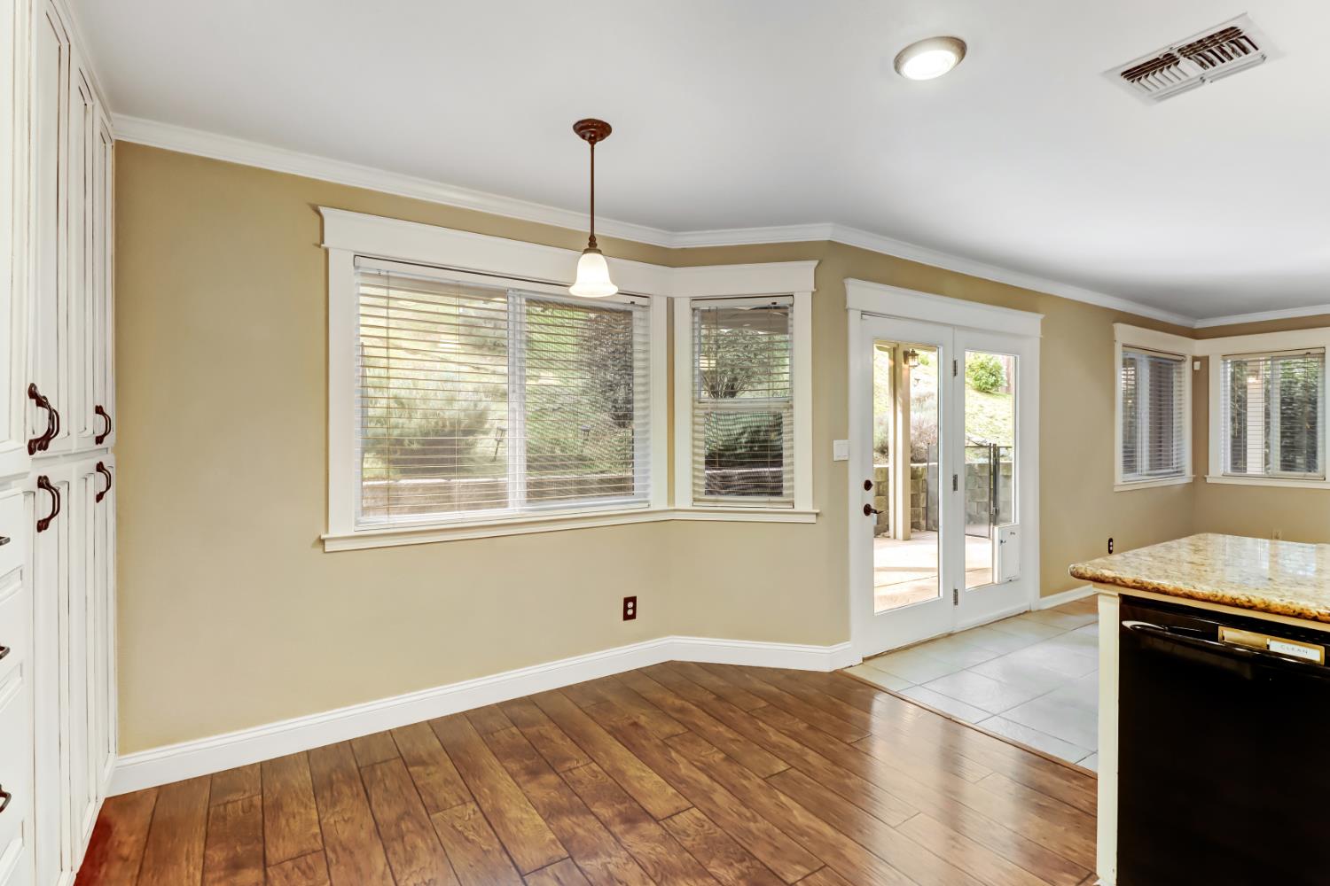 4683 Abrijo Road Cameron Park, CA 95682 - Photo 15 of 53 a view of an empty room with window and wooden floor