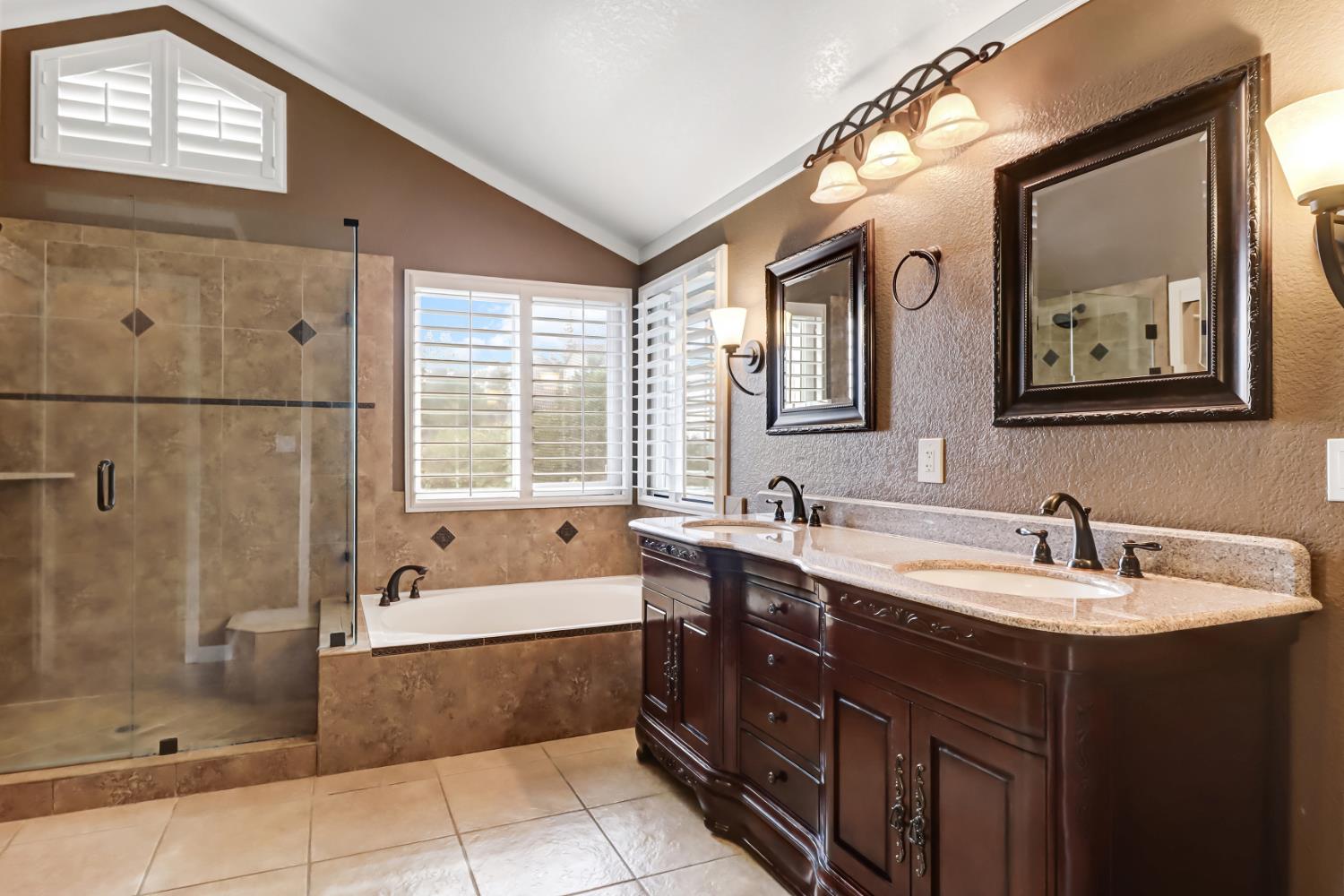4683 Abrijo Road Cameron Park, CA 95682 - Photo 19 of 53 a bathroom with a tub sink shower and mirror