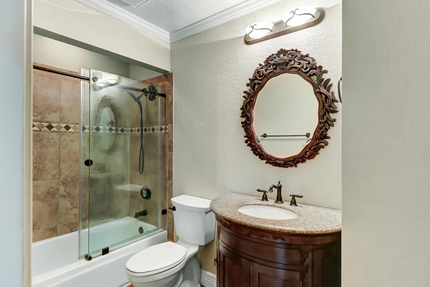 4683 Abrijo Road Cameron Park, CA 95682 - Photo 28 of 53 a bathroom with a sink a toilet and a mirror