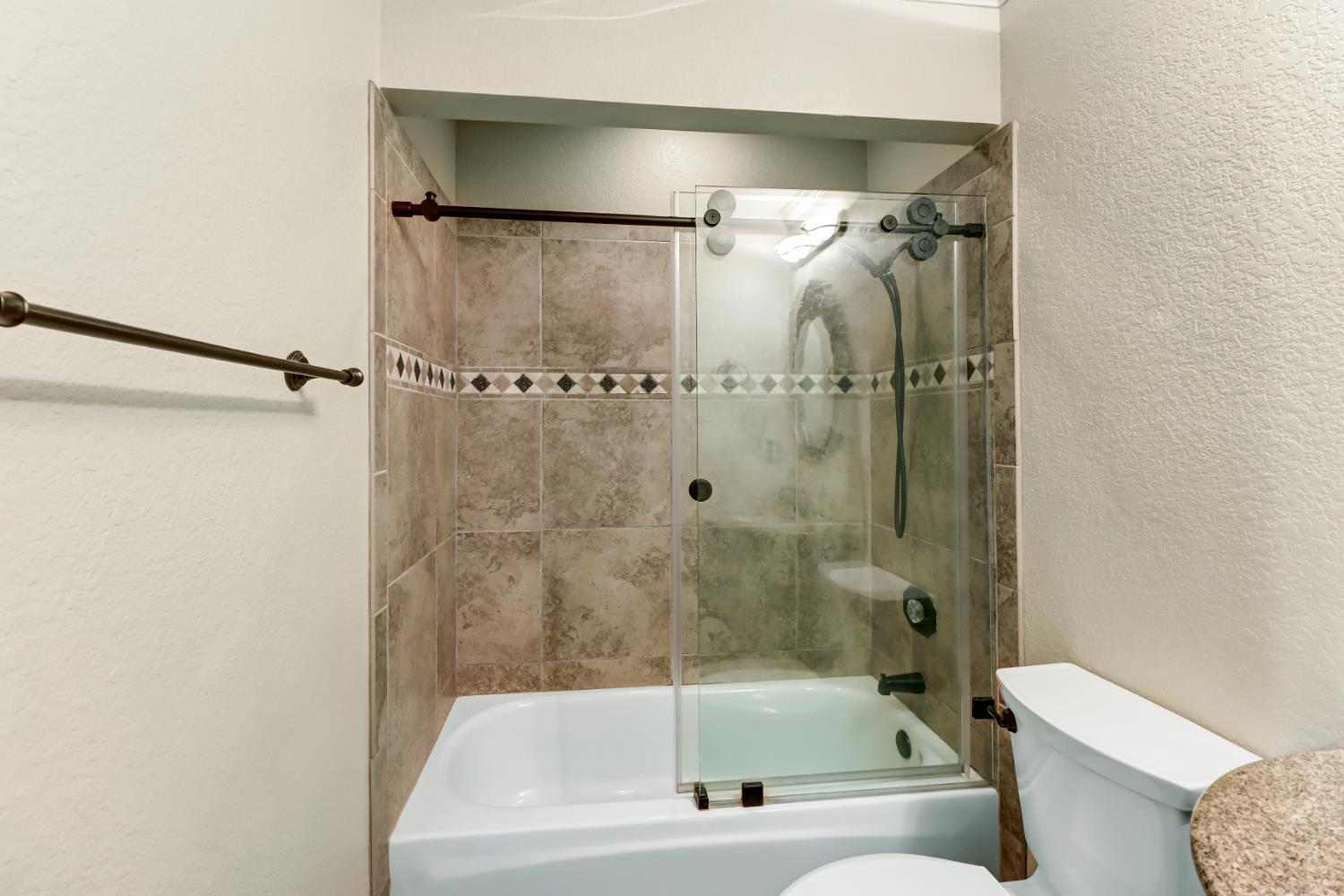 4683 Abrijo Road Cameron Park, CA 95682 - Photo 29 of 53 a bathroom with a bathtub and a shower