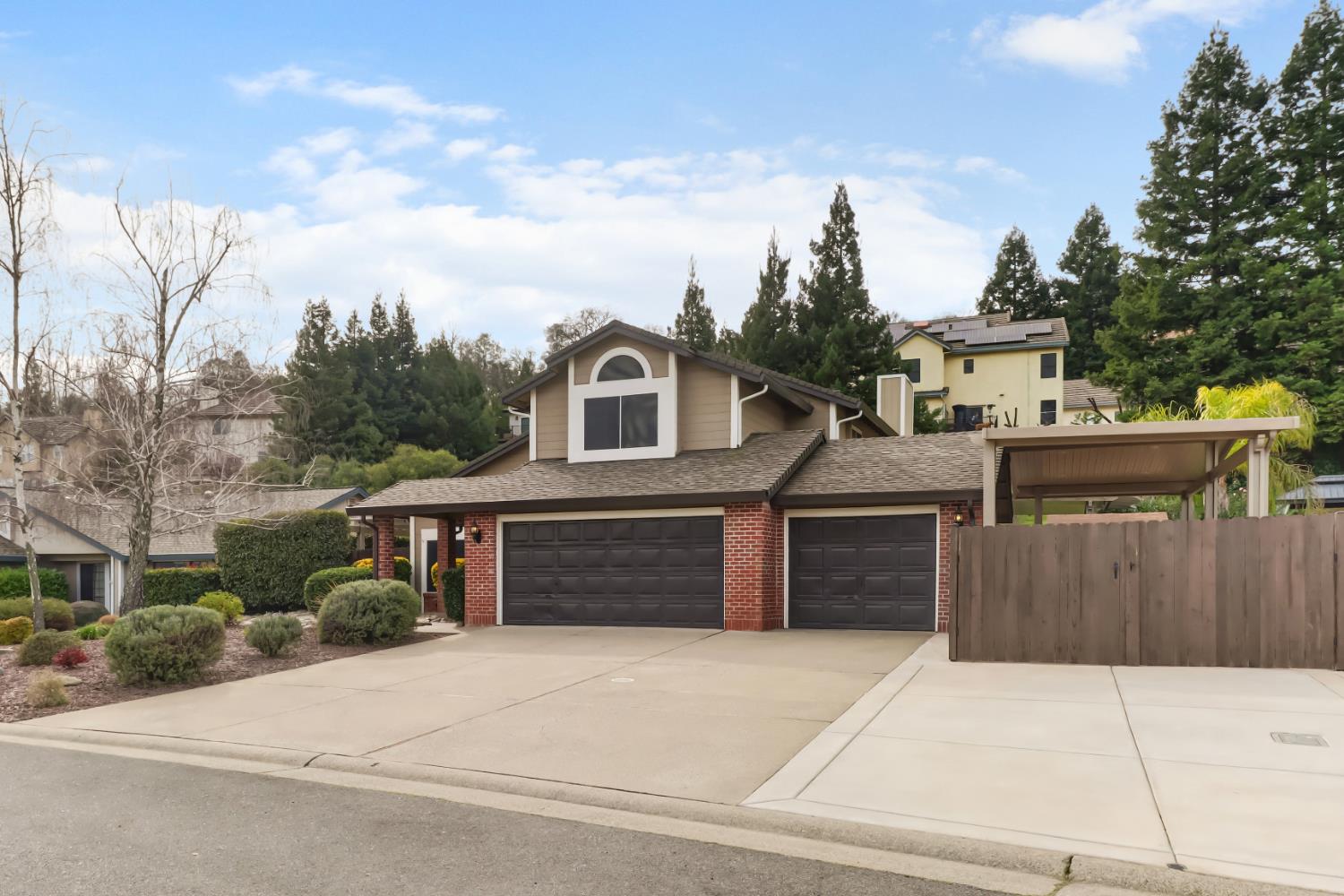 4683 Abrijo Road Cameron Park, CA 95682 - Photo 52 of 53 a front view of a house with a yard and garage