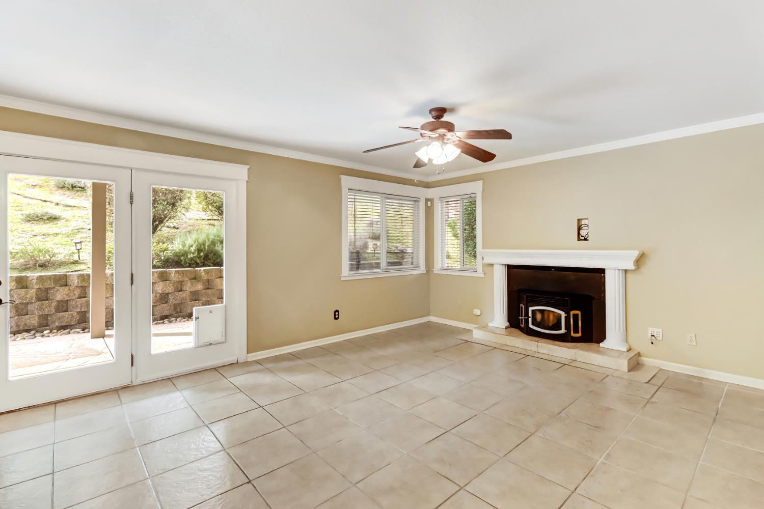 4683 Abrijo Road Cameron Park, CA 95682 - Photo 6 of 53 a view of an empty room with window and fireplace