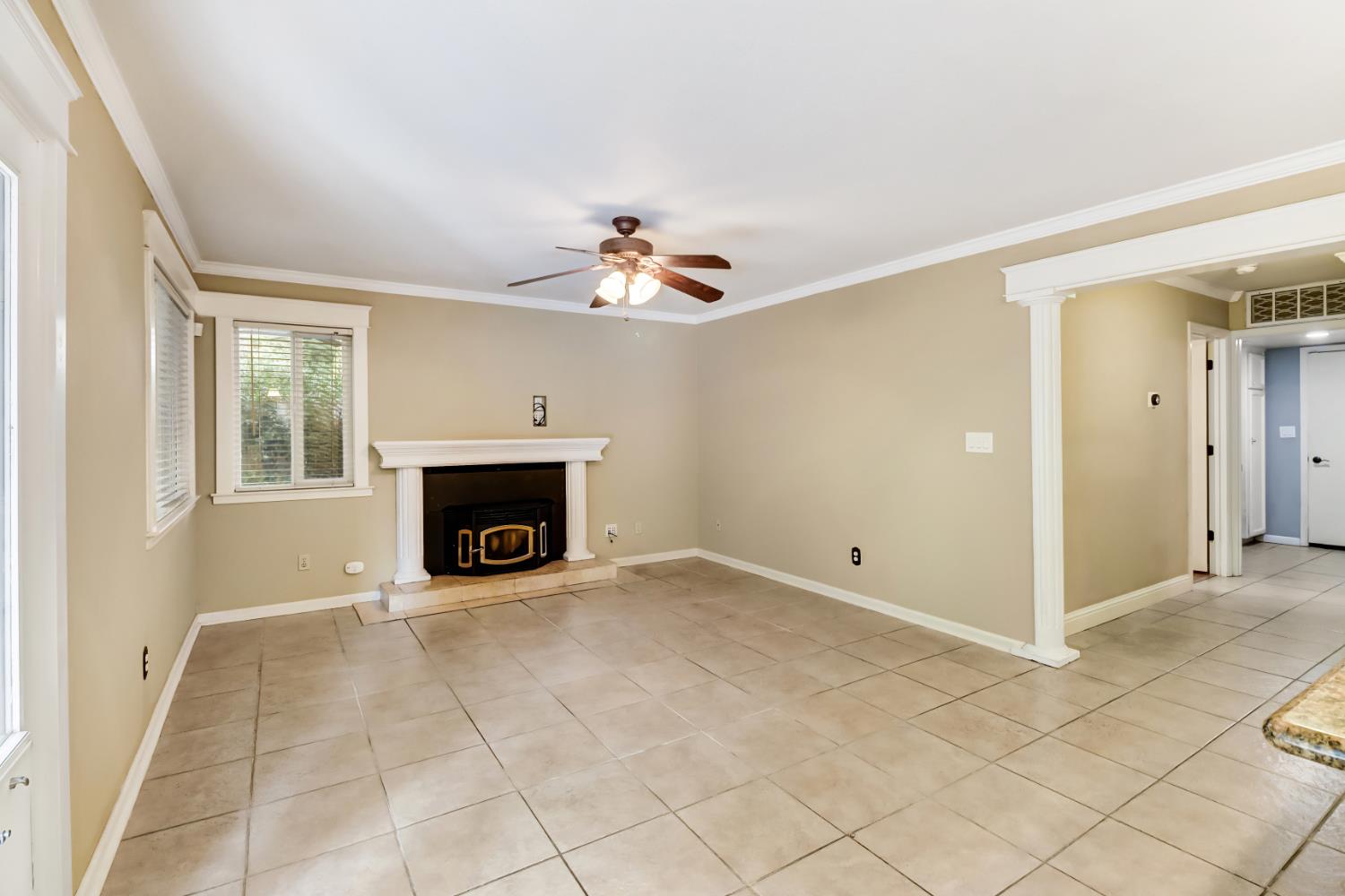 4683 Abrijo Road Cameron Park, CA 95682 - Photo 7 of 53 an empty room with windows and fireplace