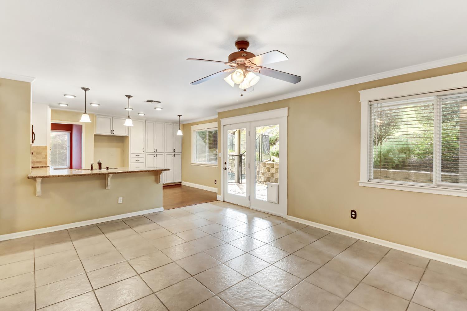 4683 Abrijo Road Cameron Park, CA 95682 - Photo 9 of 53 a view of an empty room with window and chandelier fan
