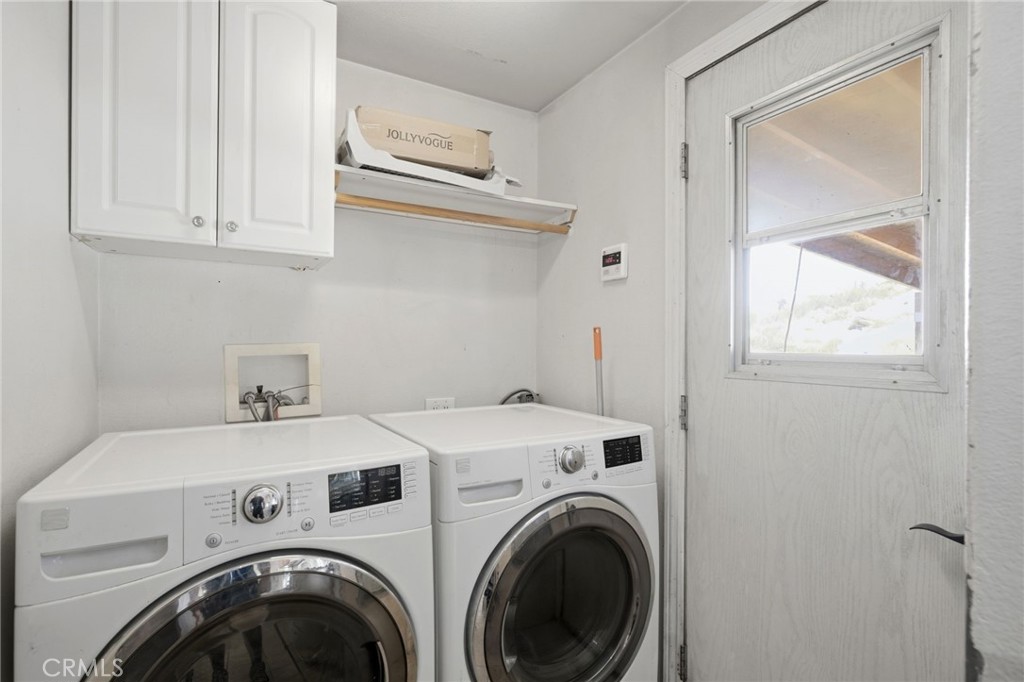 40100 Owl Valley Road Temecula, CA 92592 - Photo 30 of 44 a utility room with dryer and washer