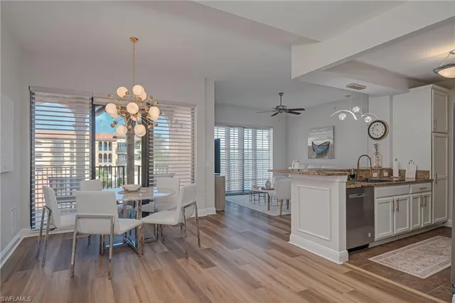a dining room with furniture and a window