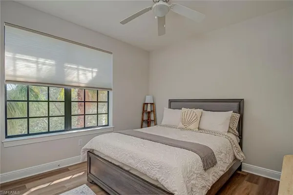 a bathroom with a bathtub sink and mirror