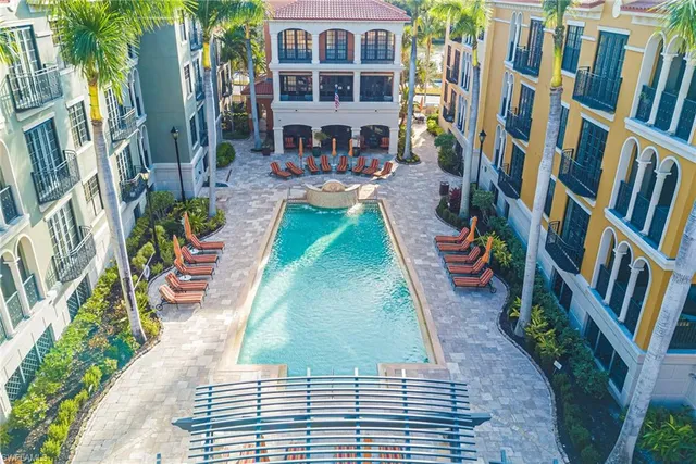 a front view of residential houses with outdoor space and trees