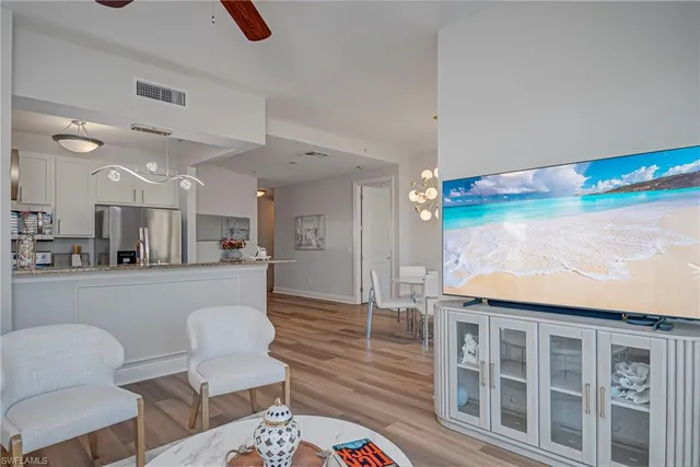 a front view of multiple houses with yard