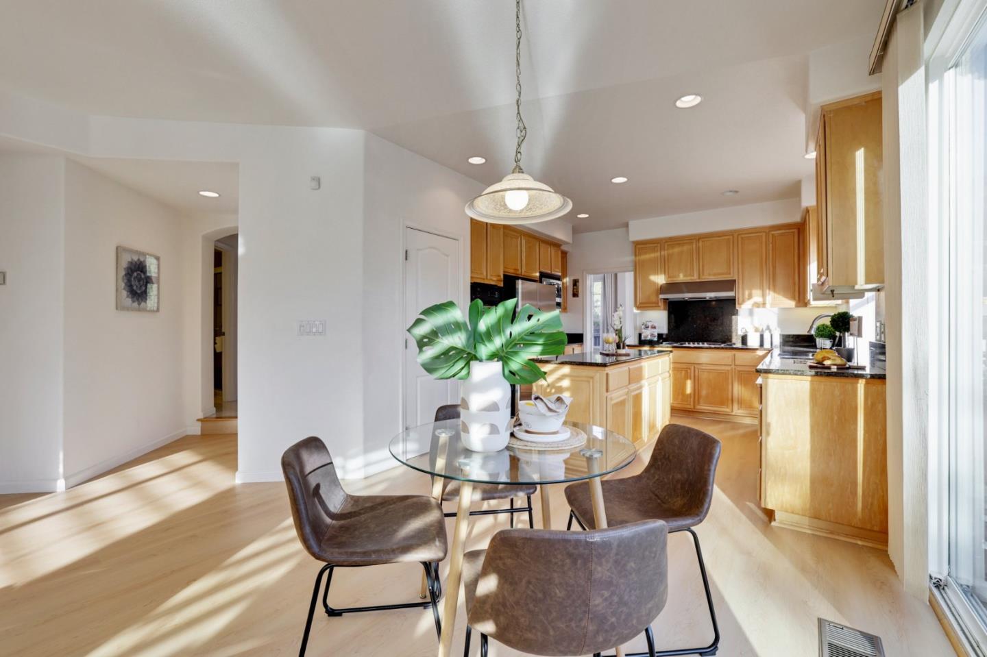 313 Lower Vintners Circle Fremont, CA 94539 - Photo 14 of 50 a view of a dining room with furniture window and wooden floor