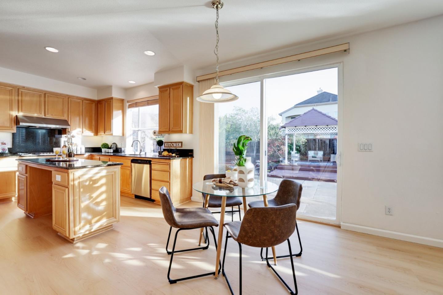313 Lower Vintners Circle Fremont, CA 94539 - Photo 20 of 50 a living room with stainless steel appliances granite countertop furniture and a wooden floor