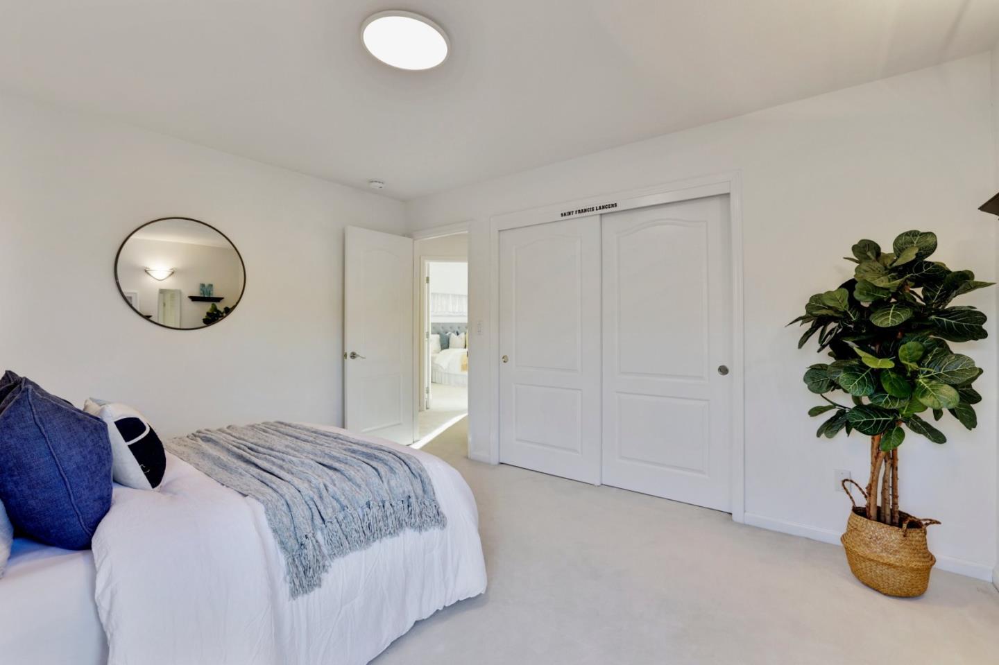 313 Lower Vintners Circle Fremont, CA 94539 - Photo 30 of 50 a bedroom with a bed and a potted plant