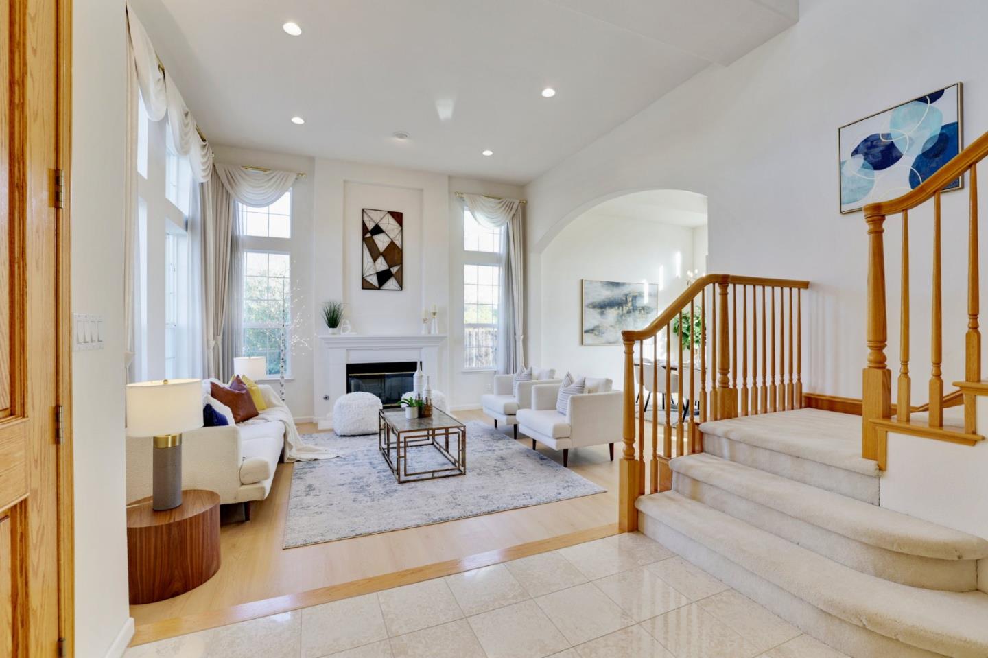 313 Lower Vintners Circle Fremont, CA 94539 - Photo 3 of 50 a living room with fireplace furniture and a window