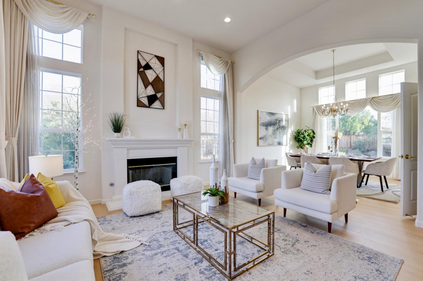 313 Lower Vintners Circle Fremont, CA 94539 - Photo 4 of 50 a living room with furniture a large window and a fireplace
