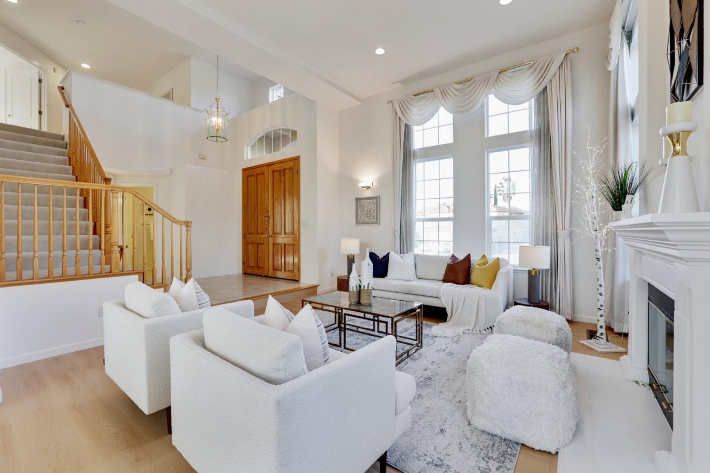 313 Lower Vintners Circle Fremont, CA 94539 - Photo 7 of 50 a living room with furniture fireplace and a large window