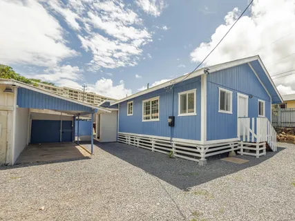 a view of a house with a street