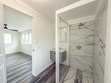 a utility room with cabinets washer and dryer
