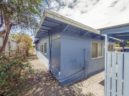 a view of a house with a backyard