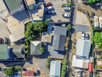 an aerial view of houses with outdoor space