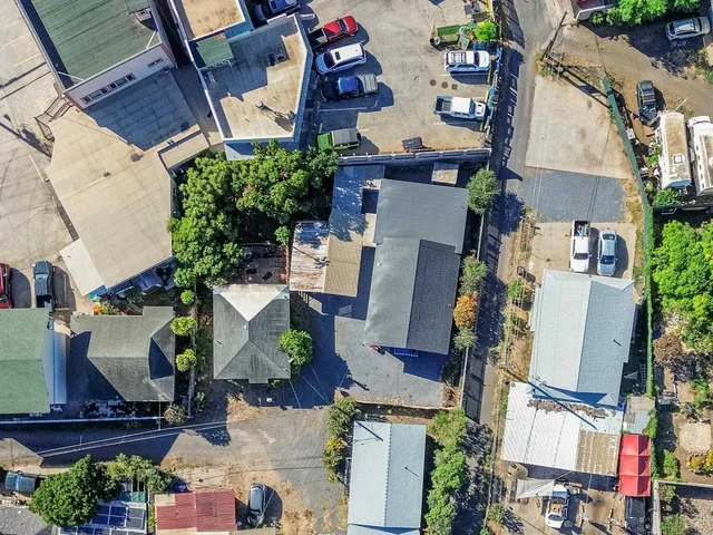 an aerial view of houses with outdoor space