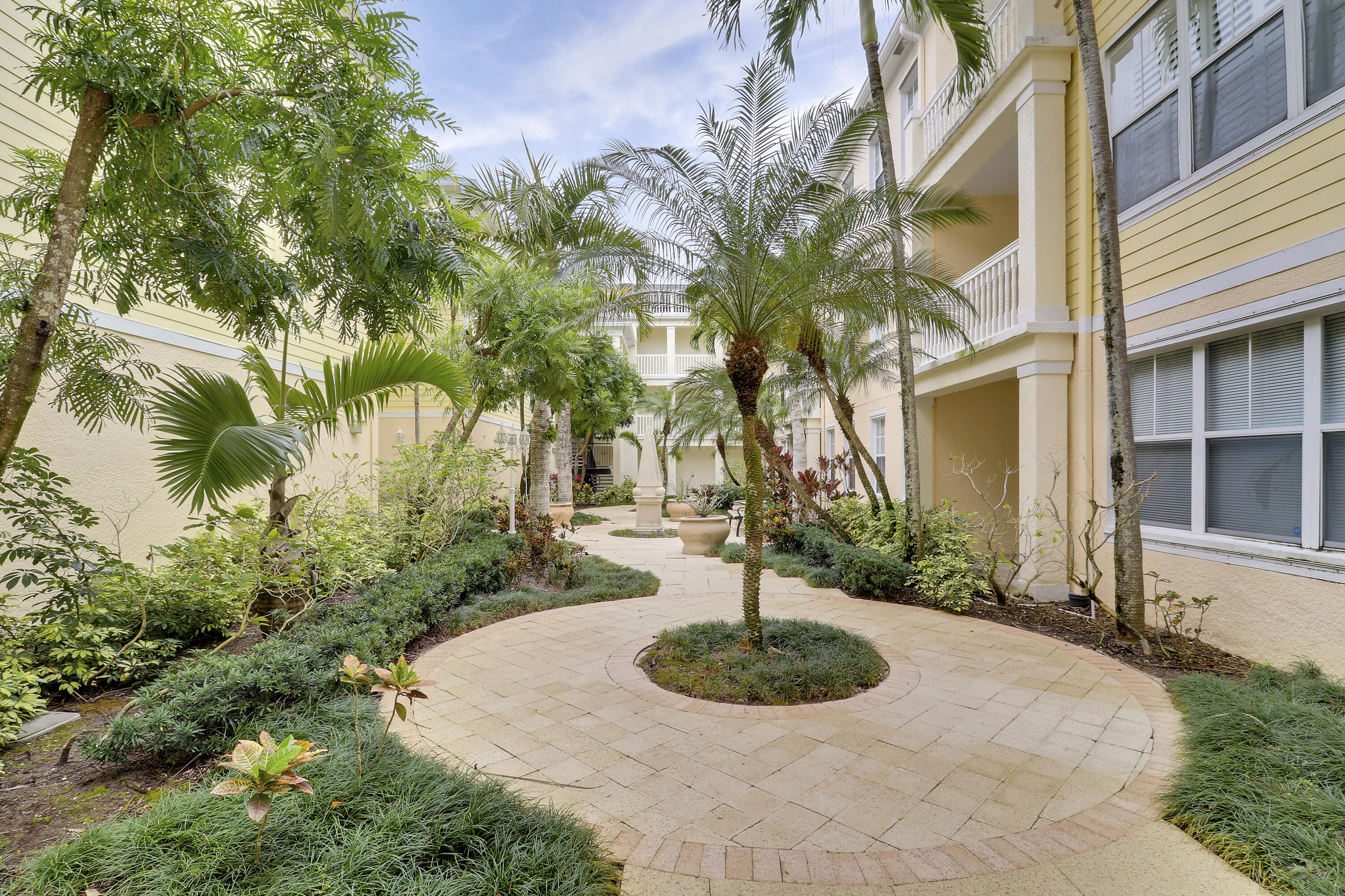225 Murcia Drive, Unit 307 Jupiter, FL 33458 - Photo 13 of 36 a view of a garden with a fountain