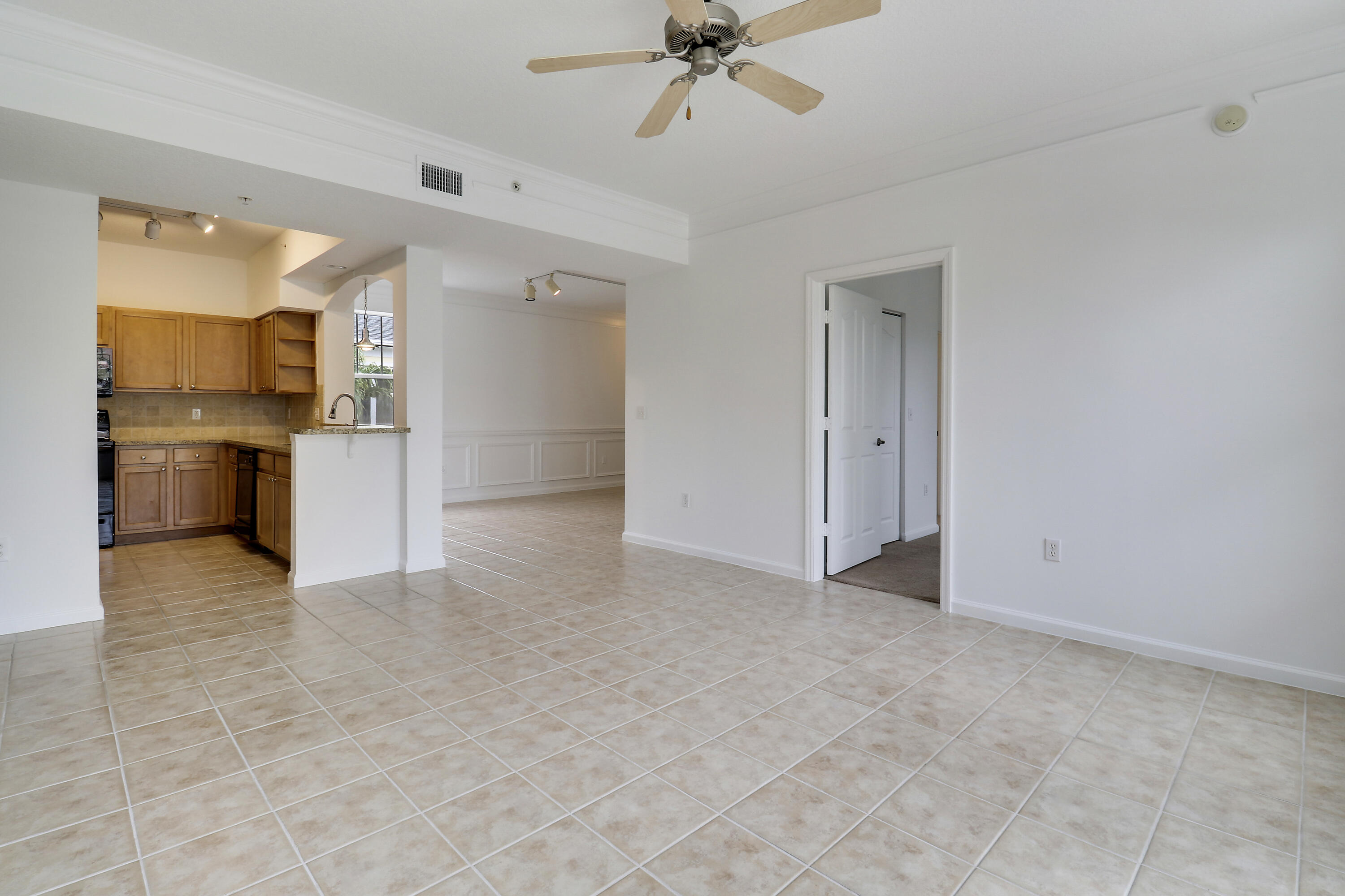 225 Murcia Drive, Unit 307 Jupiter, FL 33458 - Photo 15 of 36 a view of a kitchen with a sink and a stove top oven