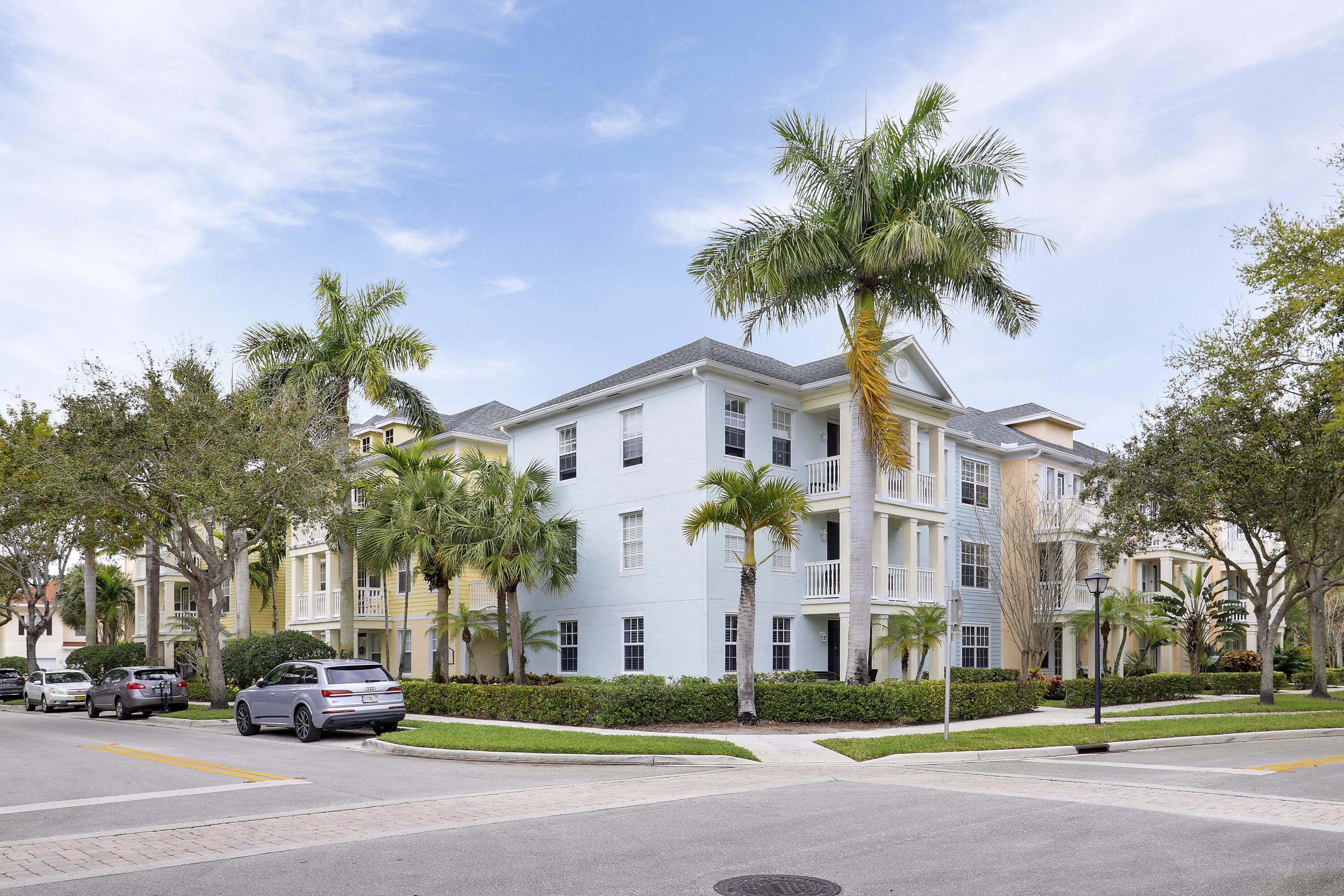 225 Murcia Drive, Unit 307 Jupiter, FL 33458 - Photo 16 of 36 a front view of multiple houses with yard
