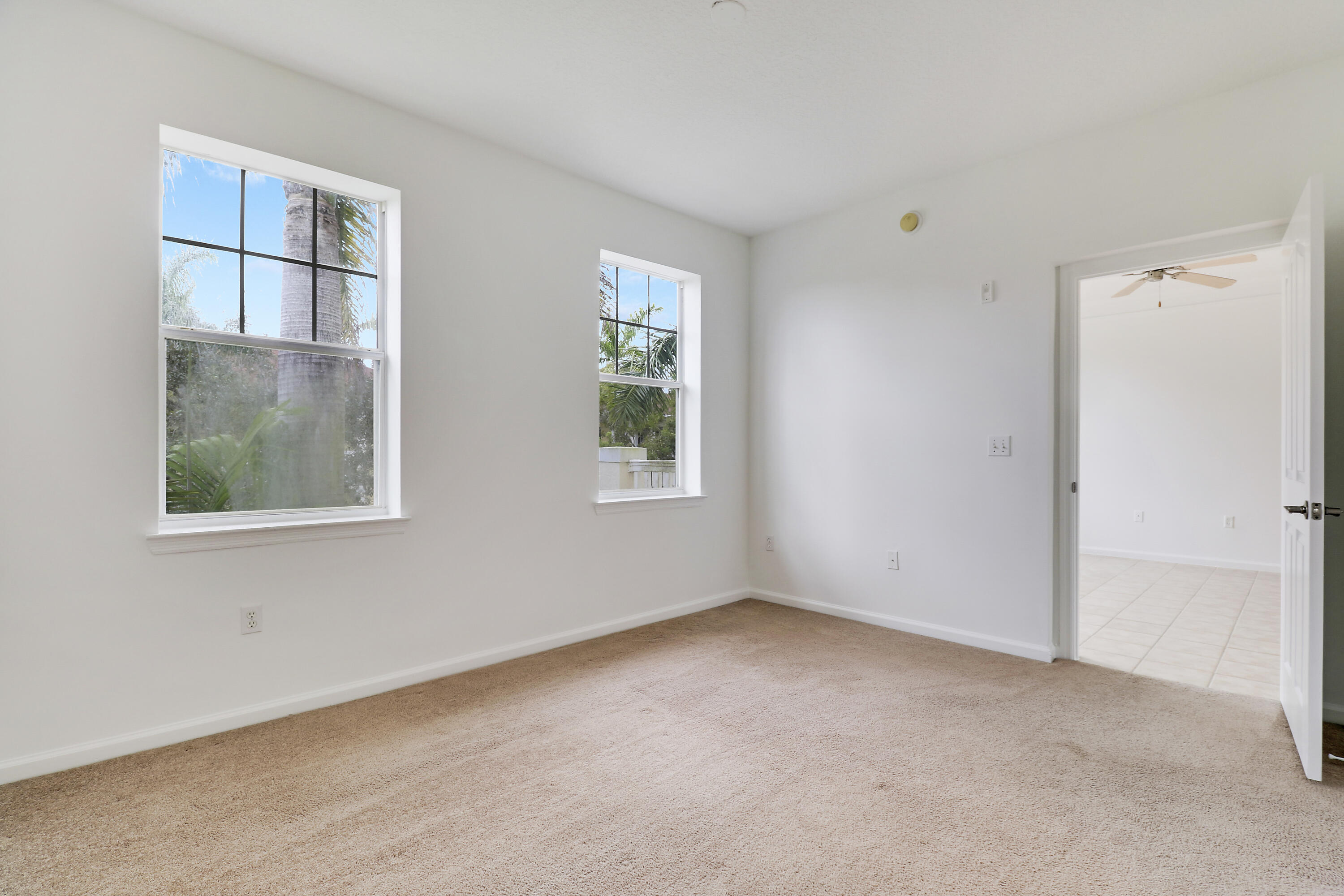225 Murcia Drive, Unit 307 Jupiter, FL 33458 - Photo 18 of 36 an empty room with windows