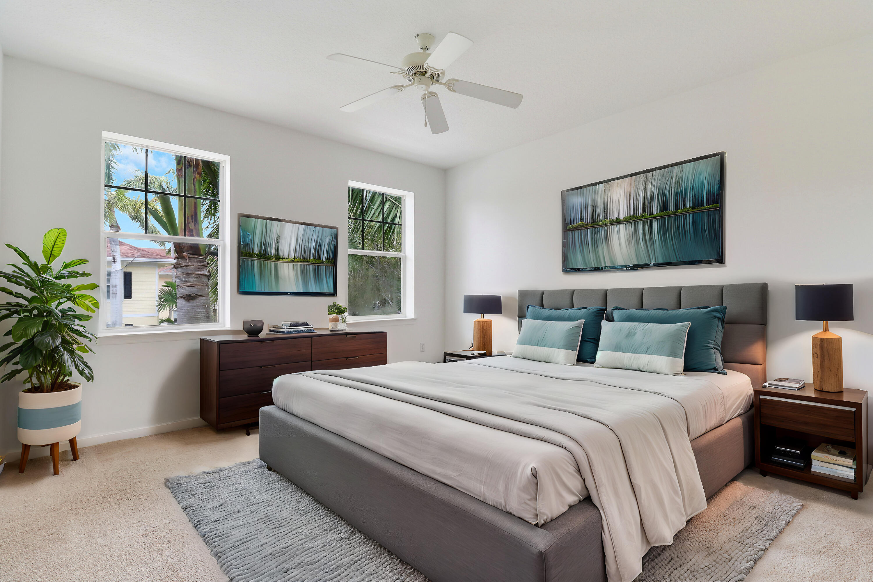 225 Murcia Drive, Unit 307 Jupiter, FL 33458 - Photo 25 of 36 a bedroom with bed a chandelier and windows