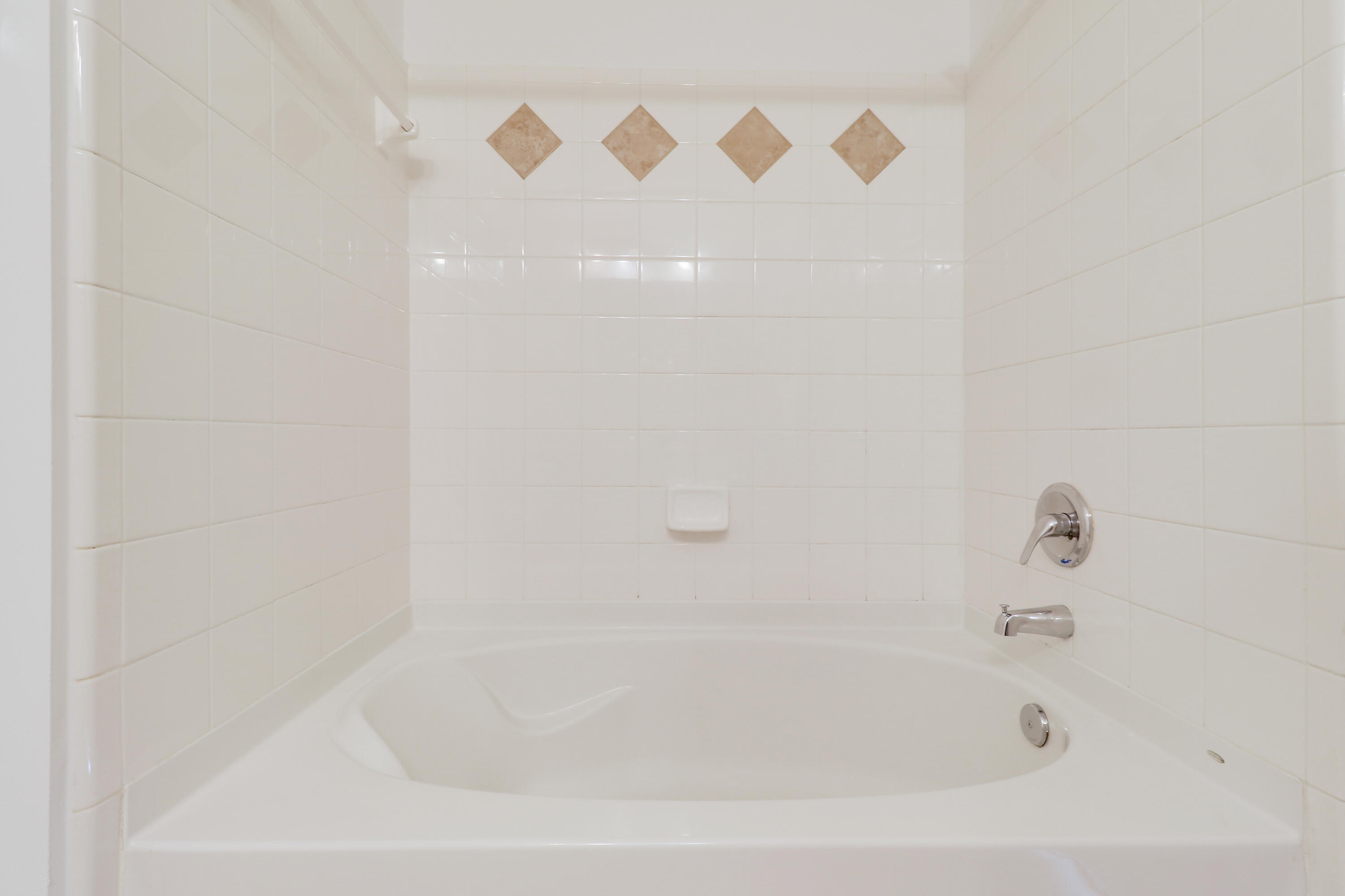 225 Murcia Drive, Unit 307 Jupiter, FL 33458 - Photo 27 of 36 a close up of a bathtub in a bathroom