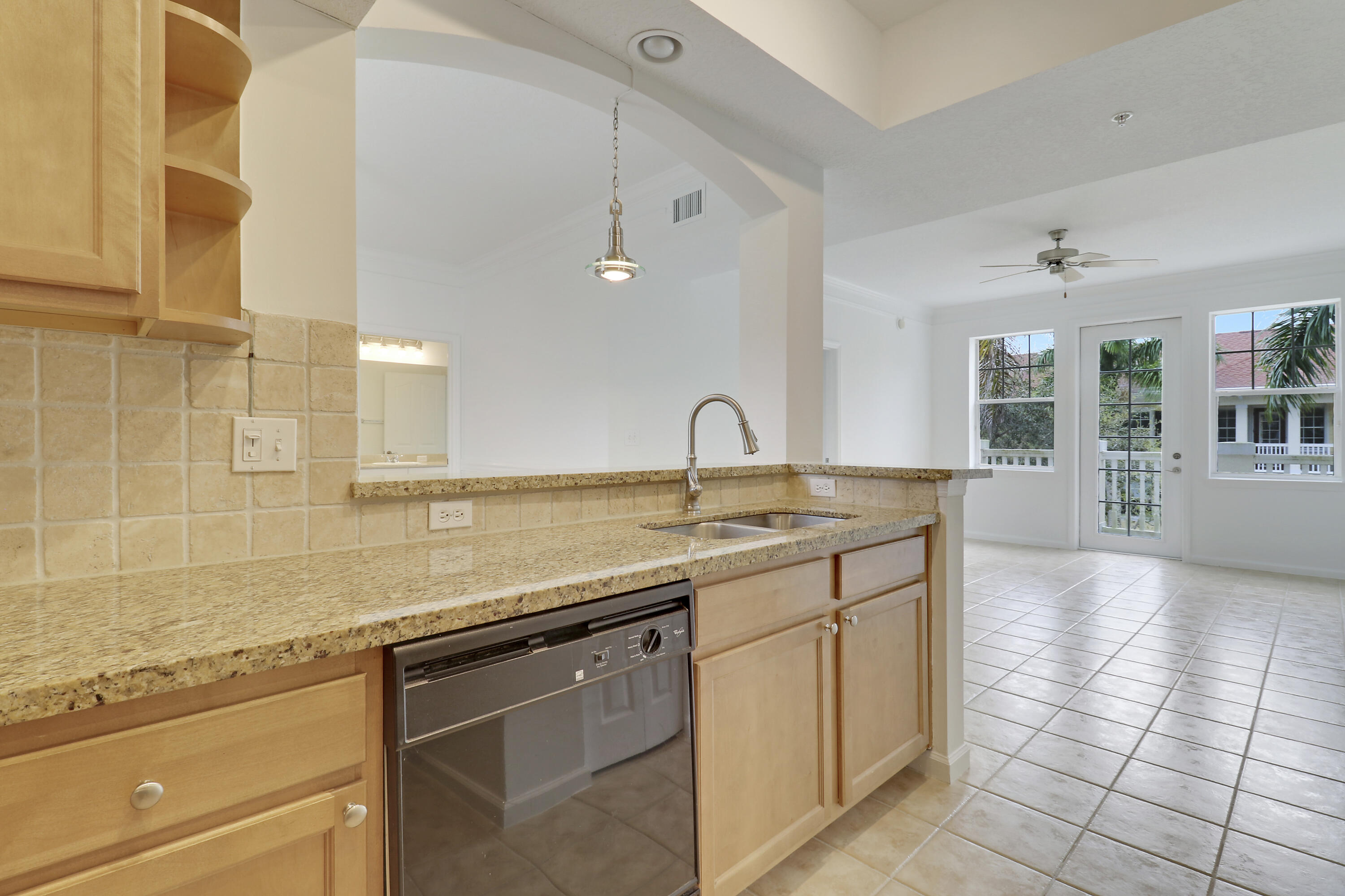 225 Murcia Drive, Unit 307 Jupiter, FL 33458 - Photo 31 of 36 a kitchen with a sink and cabinets