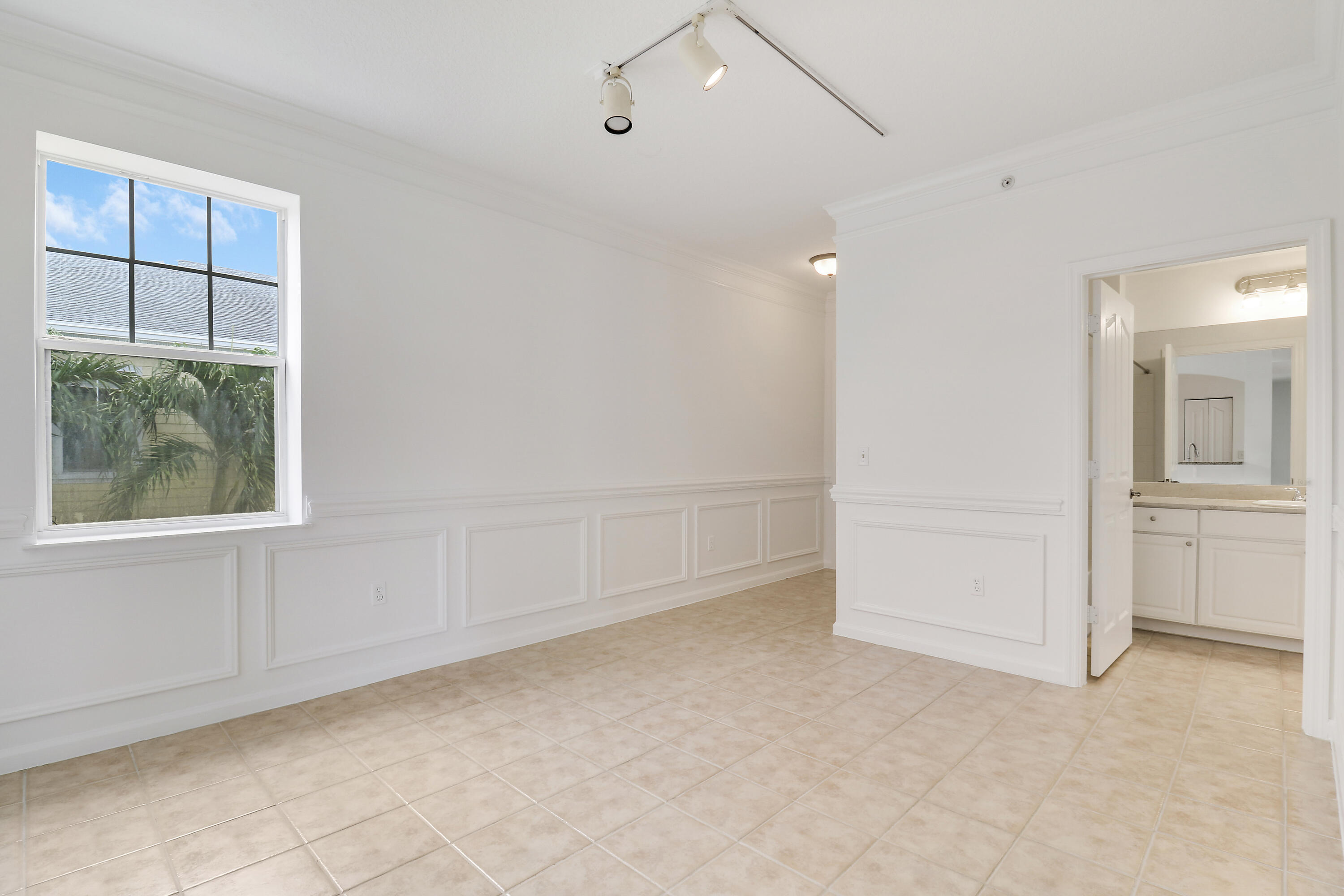 225 Murcia Drive, Unit 307 Jupiter, FL 33458 - Photo 4 of 36 an empty room with windows and closet