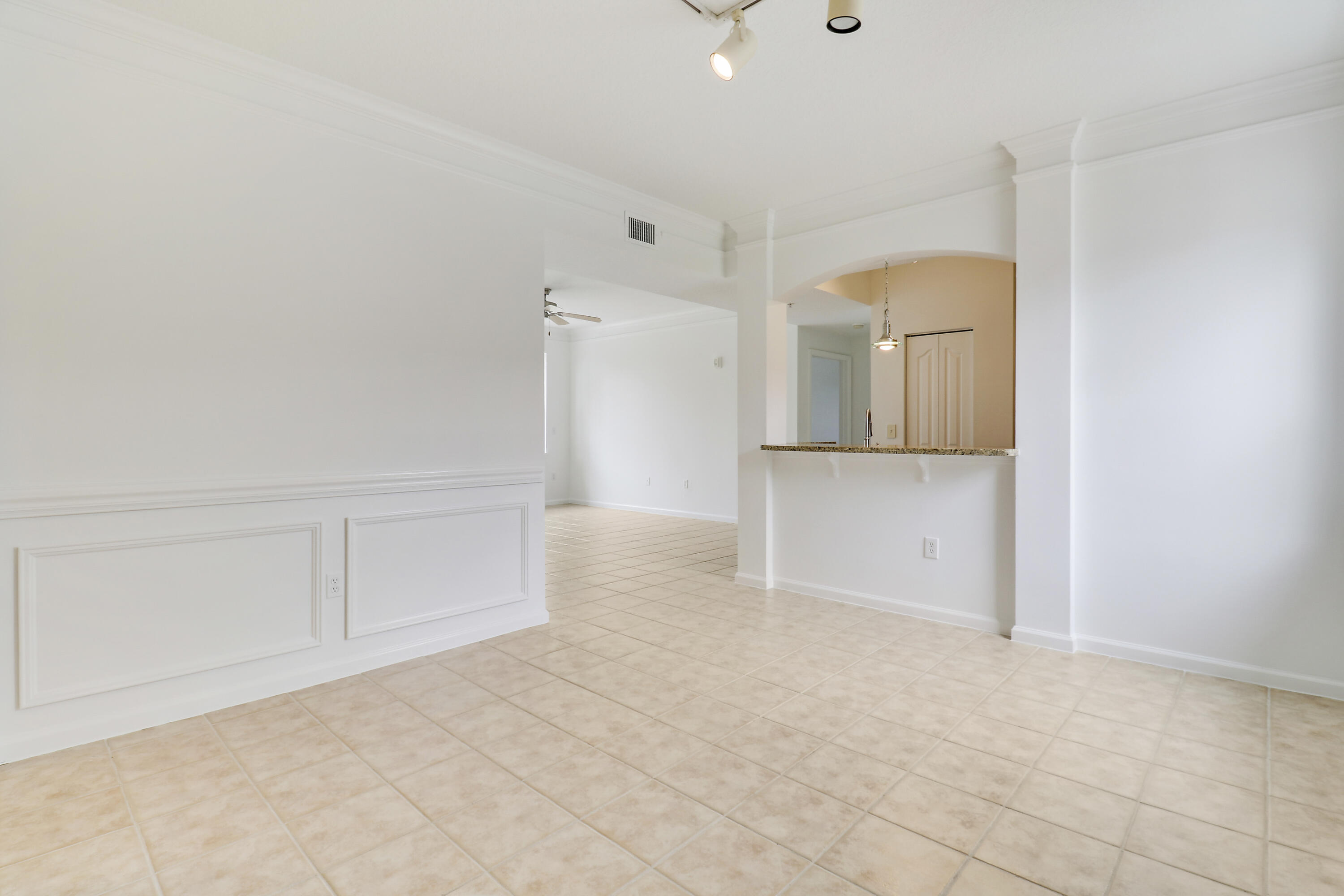 225 Murcia Drive, Unit 307 Jupiter, FL 33458 - Photo 7 of 36 an empty room with cabinet and mirrors