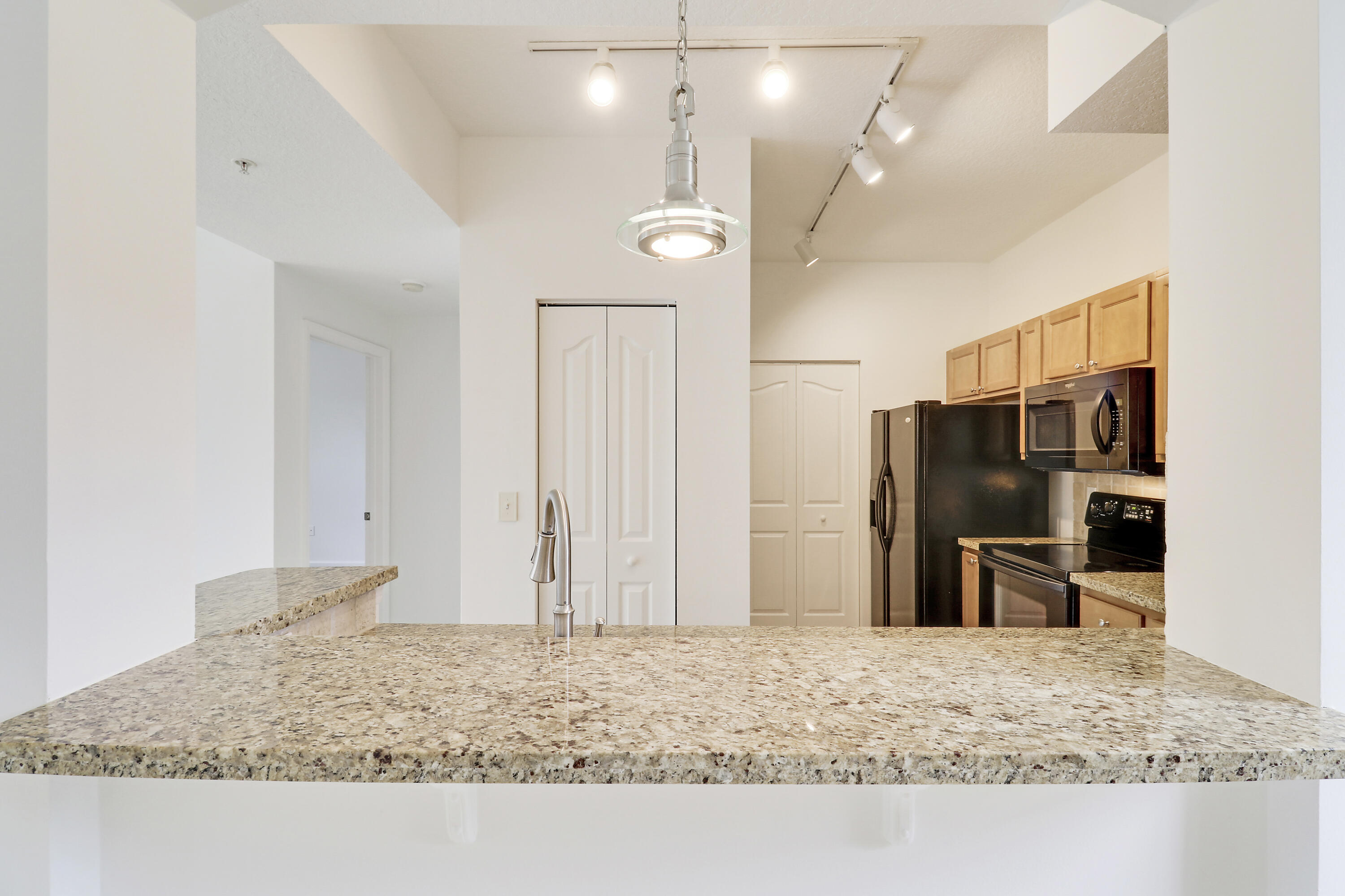 225 Murcia Drive, Unit 307 Jupiter, FL 33458 - Photo 8 of 36 a view of a kitchen counter space and a sink