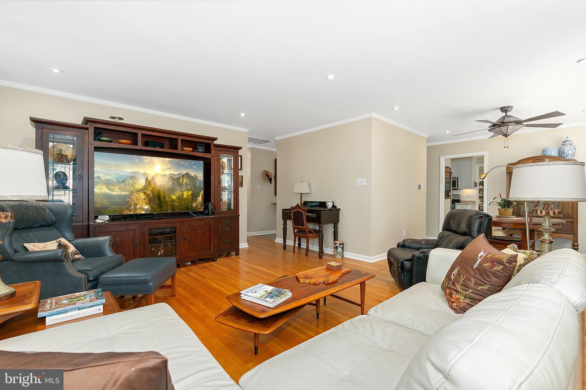 3004 Bluff Point Lane Silver Spring, MD 20906 - Photo 13 of 74 a living room with furniture and a flat screen tv