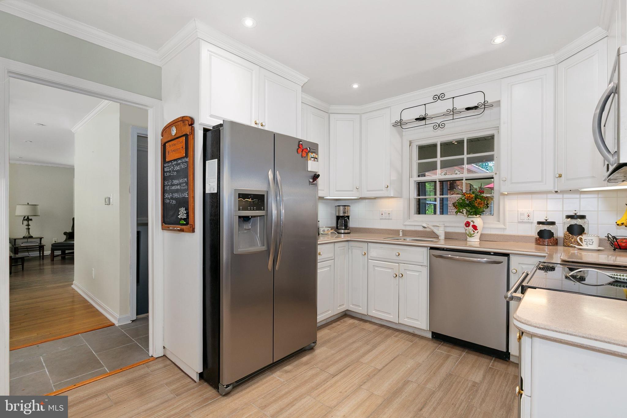 3004 Bluff Point Lane Silver Spring, MD 20906 - Photo 16 of 74 a kitchen with granite countertop stainless steel appliances a refrigerator a sink and cabinets