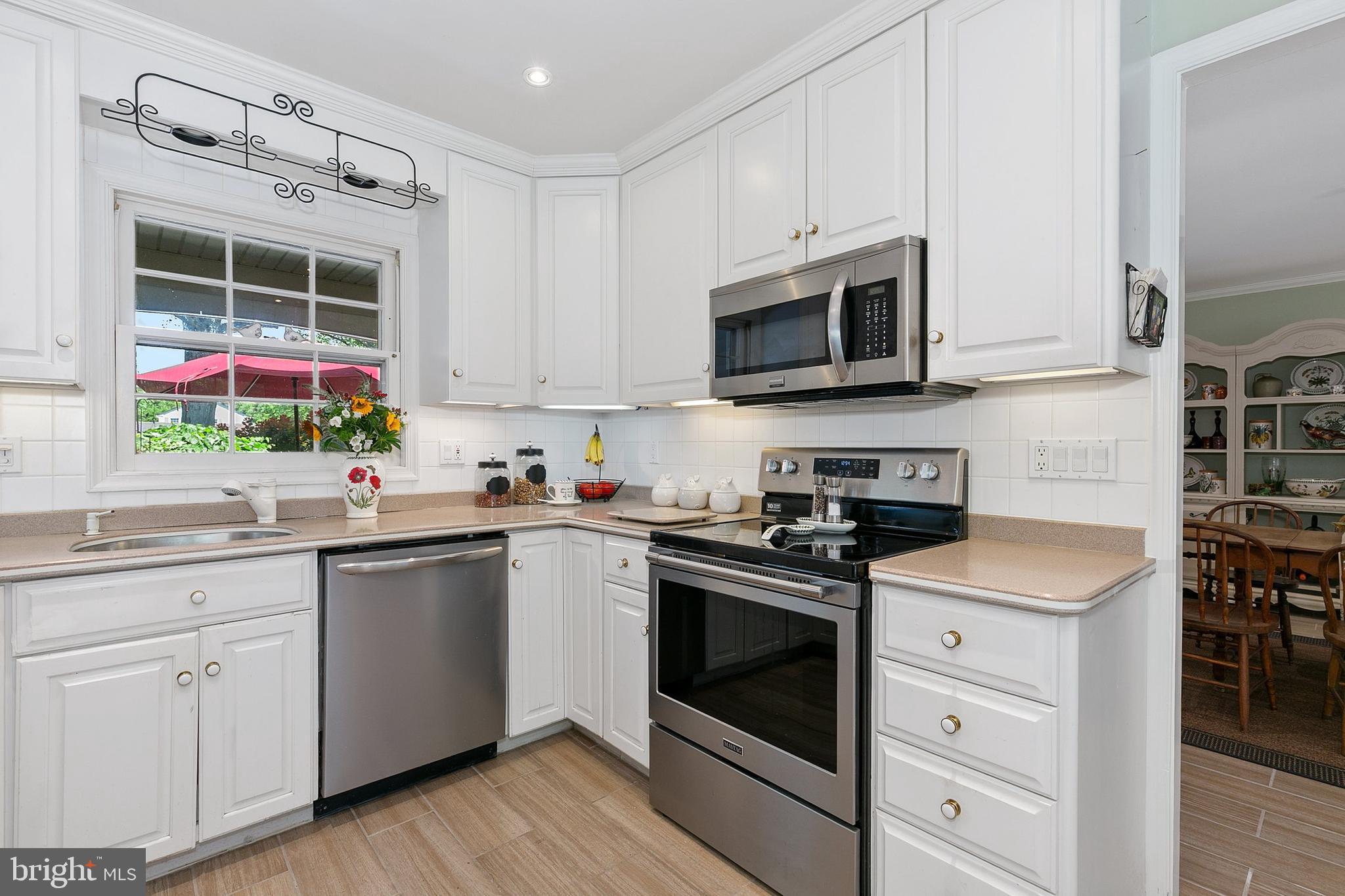 3004 Bluff Point Lane Silver Spring, MD 20906 - Photo 18 of 74 a kitchen with cabinets appliances and a sink