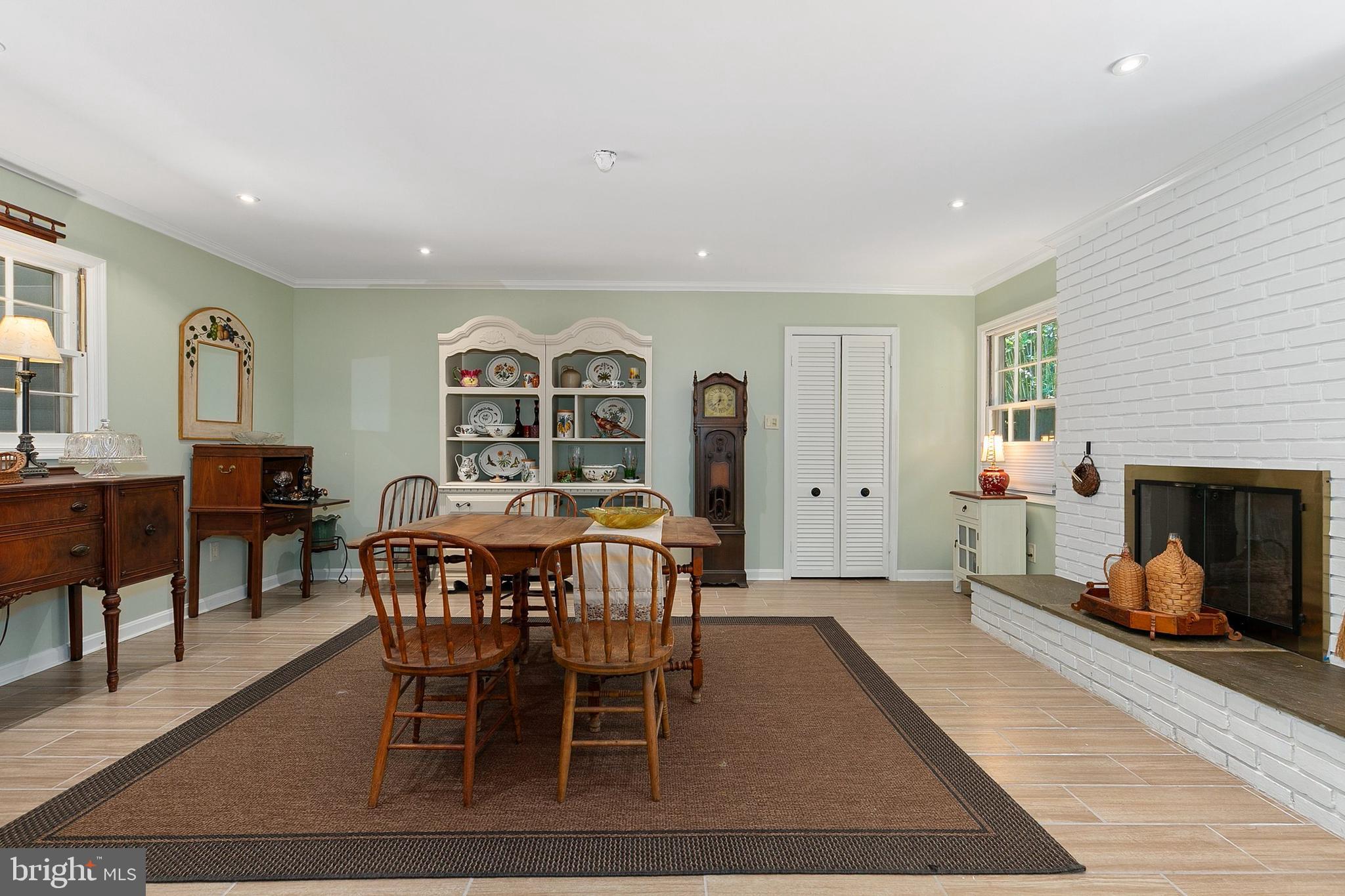 3004 Bluff Point Lane Silver Spring, MD 20906 - Photo 31 of 74 a view of a dining room with furniture and a fireplace