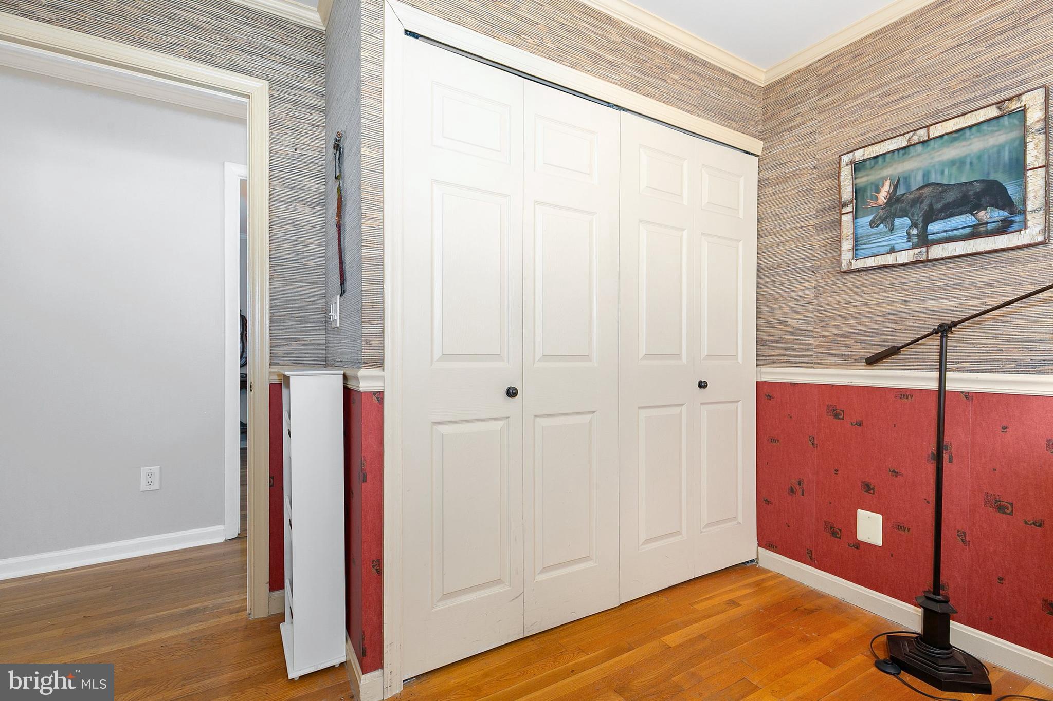3004 Bluff Point Lane Silver Spring, MD 20906 - Photo 38 of 74 a view of a room with wooden floor and cabinet