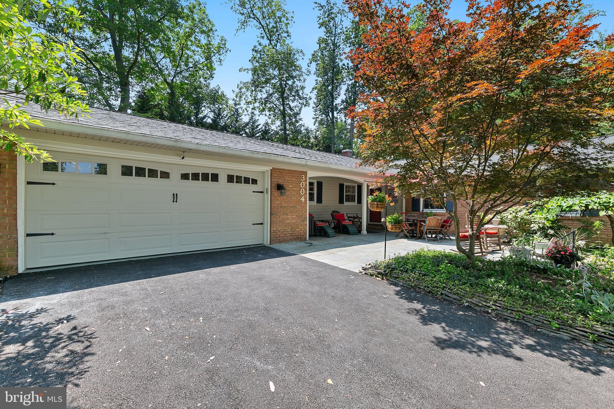 3004 Bluff Point Lane Silver Spring, MD 20906 - Photo 4 of 74 a front view of a house with a yard and garage