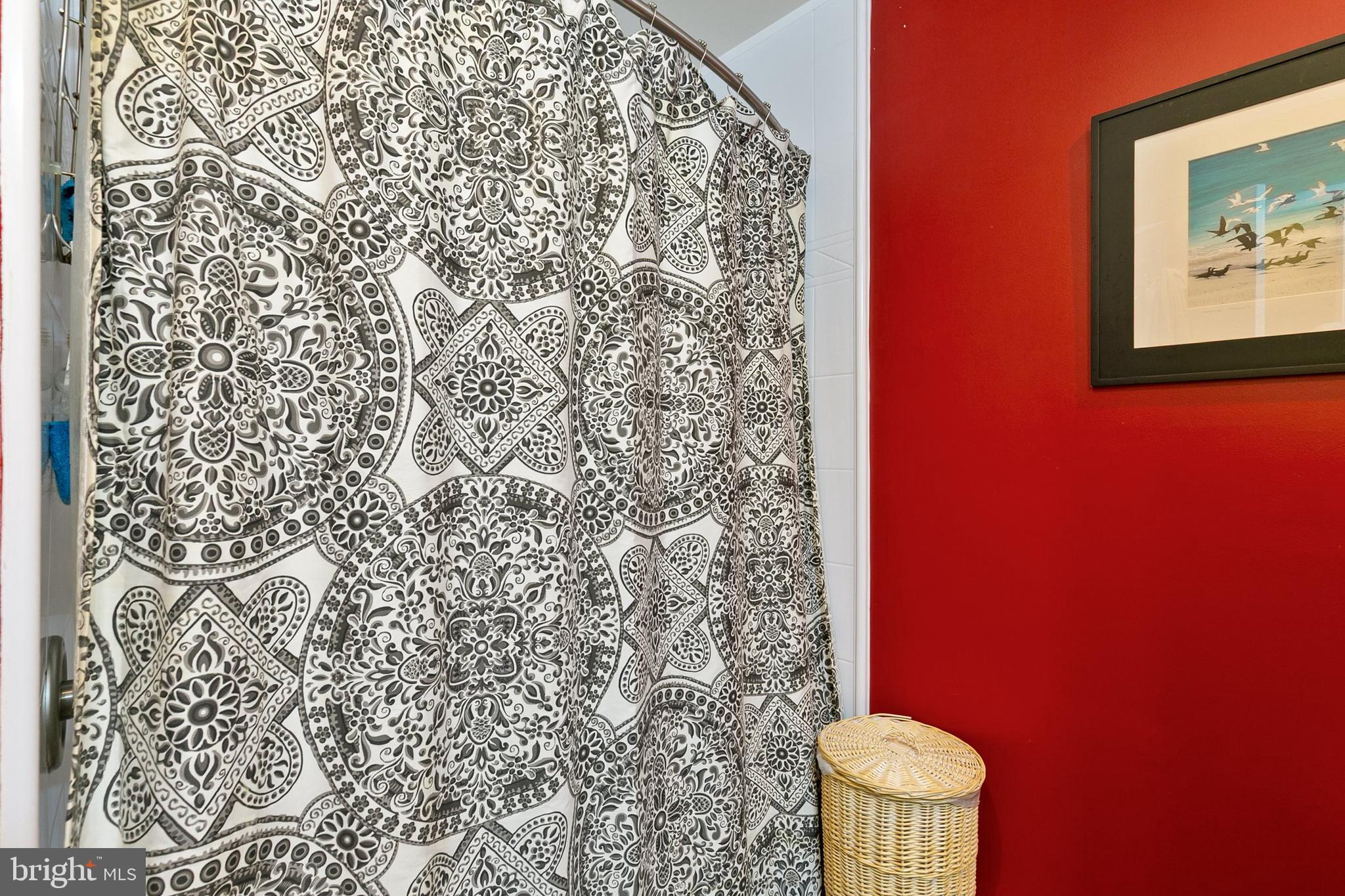 3004 Bluff Point Lane Silver Spring, MD 20906 - Photo 41 of 74 a bathroom with a toilet and a shower curtain