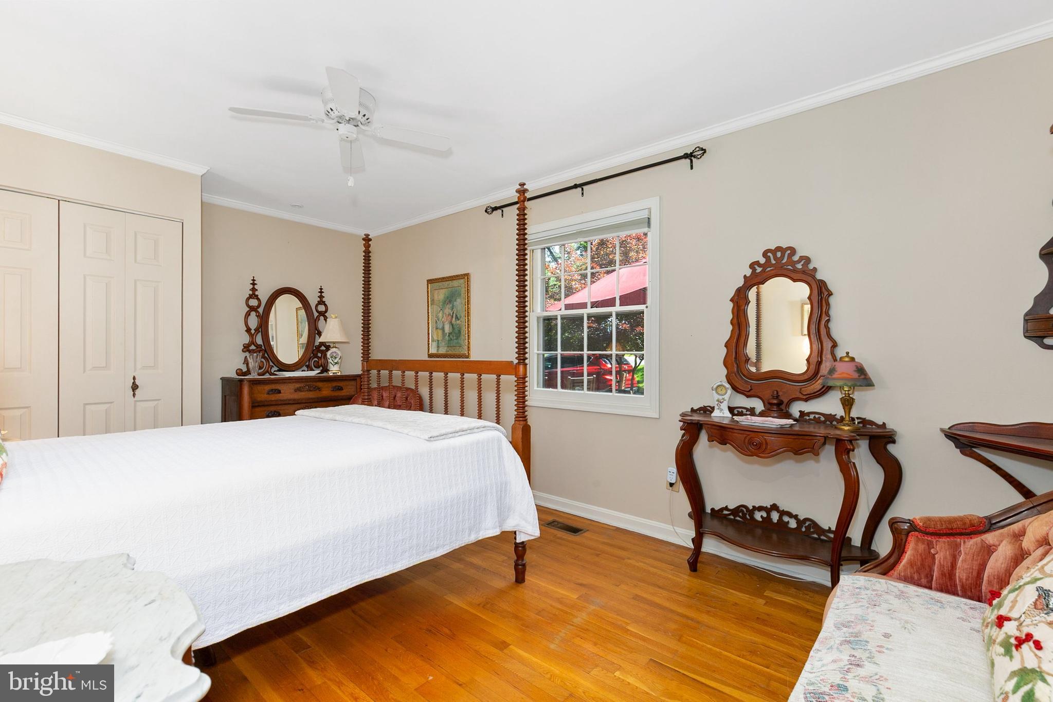 3004 Bluff Point Lane Silver Spring, MD 20906 - Photo 42 of 74 a bedroom with a bed a dresser and chair
