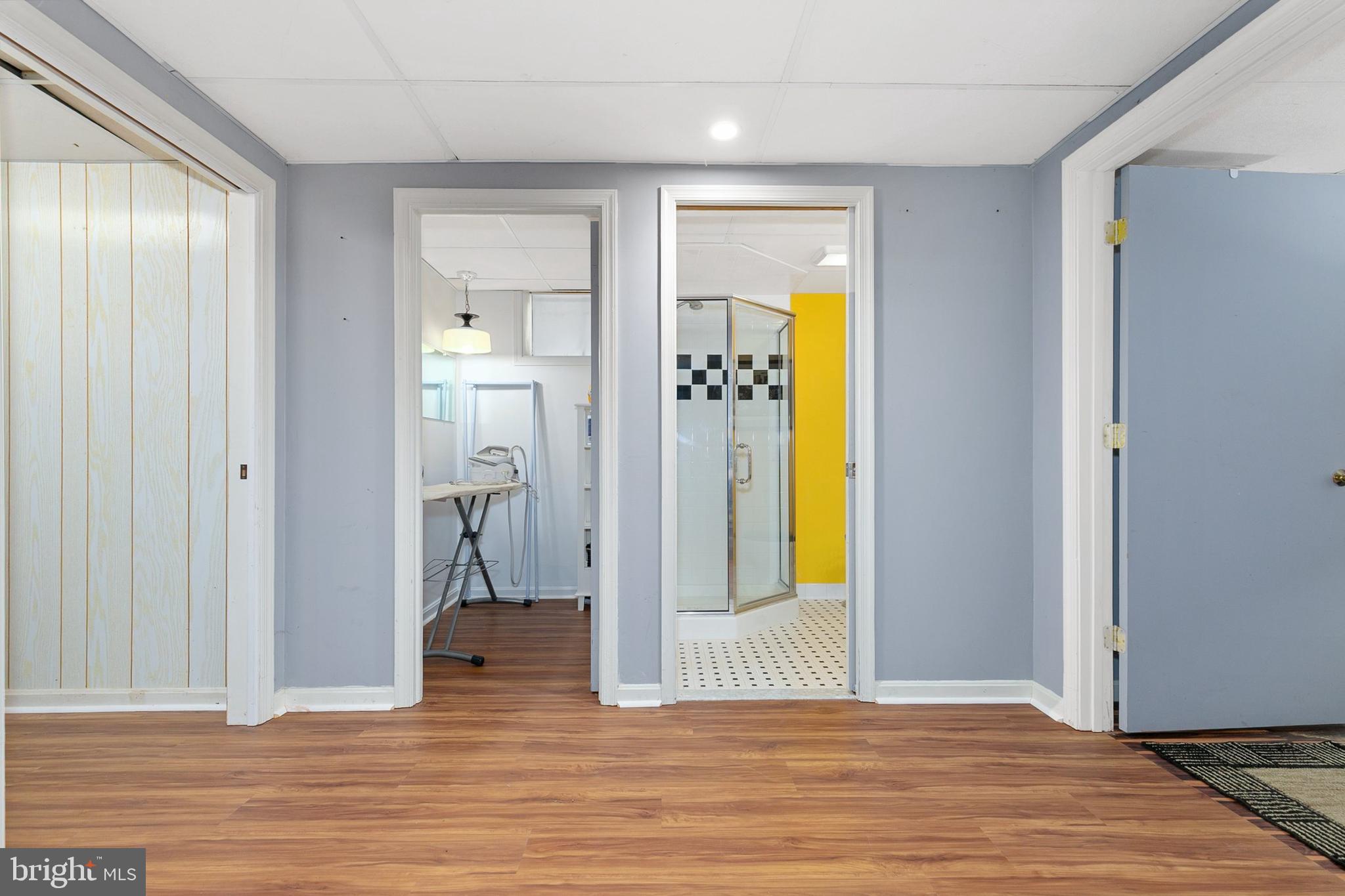 3004 Bluff Point Lane Silver Spring, MD 20906 - Photo 50 of 74 a view of a livingroom with wooden floor and a hallway